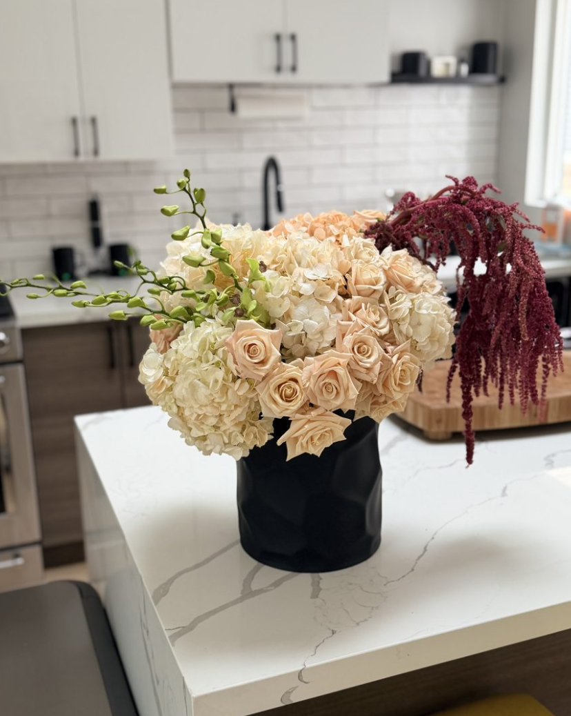 A lush rose and hydrangea arrangement