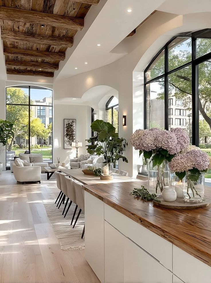Hydrangeas on a live-edge island in an open, sunlit kitchen