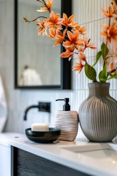 Orange blooms styled on a bathroom vanity