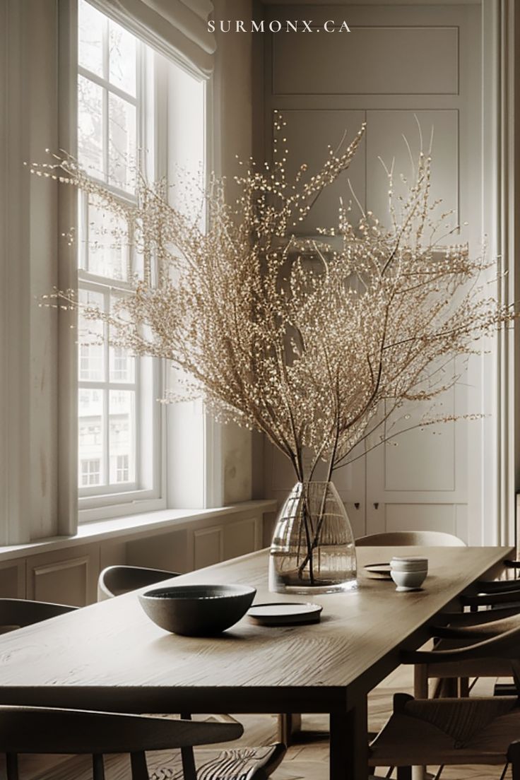 Branching blooms on a sunlit dining table